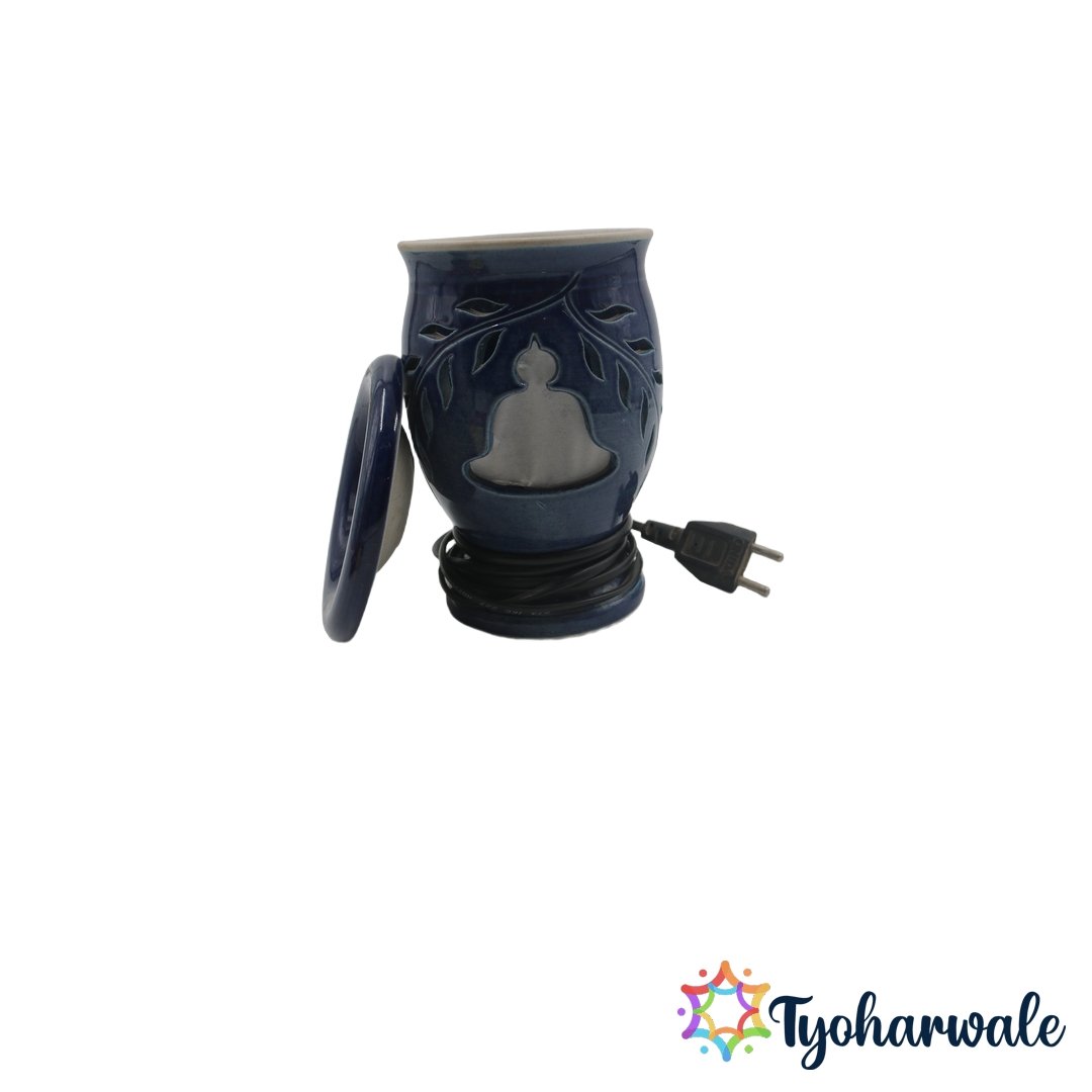 Blue electric aroma diffuser with cutout meditation motif for bedrooms and pooja spaces.