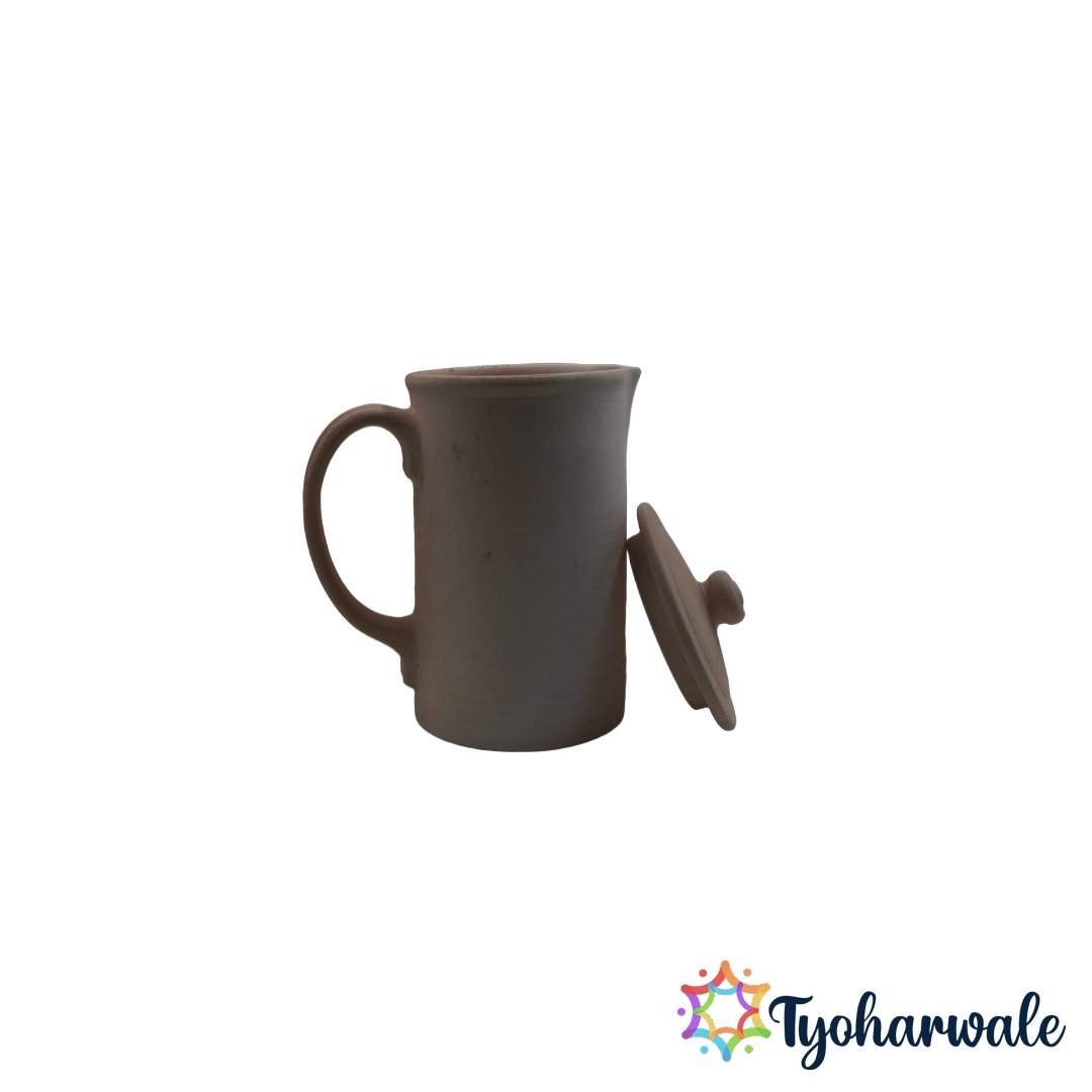 Traditional clay water jug with handle and lid for dining use.