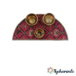 Half moon haldi kumkum set on pink geometric fabric with 3 brass bowls and pearl border