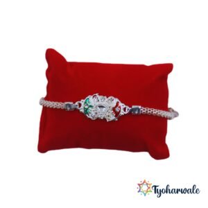 Designer Rakhi for brother with red and green detailing and premium stone work