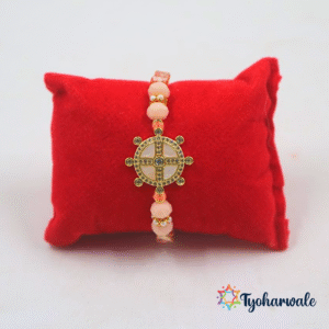 Elegant wheel design beaded rakhi with gold-tone charm, shimmering stones and pink beads