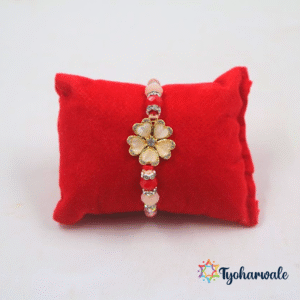 Elegant flower charm beaded Rakhi with soft pink petals, red and pink beads