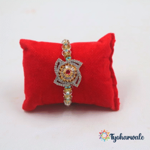 Elegant Ornate Beaded Rakhi with intricate centre charm and red decorative detail