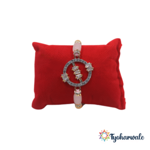 Elegant Circular Ornate Beaded Rakhi with sparkling centre charm and pink green beads
