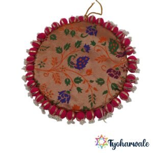 Reversible pooja mat large with magenta pom-pom pearl border used as a mandir backdrop